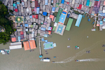 Aerial view over the floating fishing village at Ko Panyi (or Koh Panyee) one of famous travel destination in Phang Nga Bay, Phang Nga province, Thailand. - obrazy, fototapety, plakaty