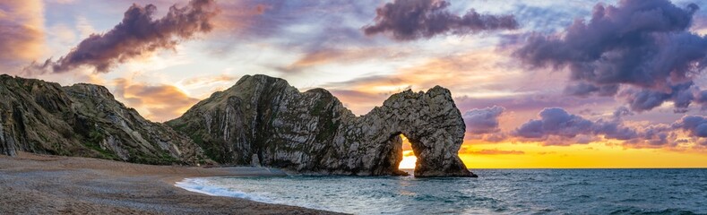 Durdle Door sunrise panorama in Dorset. England