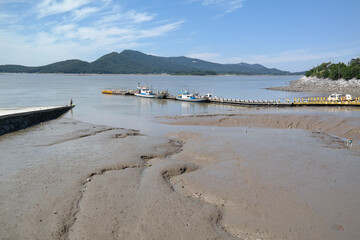 Wide open tidal flats and clouds in the sky