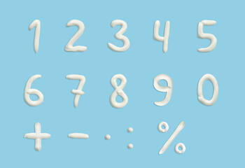 numbers of English alphabet in the form of squeezed cream in white on a blue background.