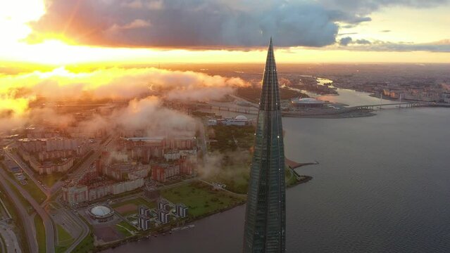 Aerial view of the spire of a skyscraper Lakhta Center and a panorama coast of the Gulf of Finland and the islands of the city, the Zenith Arena stadium. Russia, Saint-Petersburg, 10 september 2019