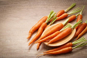 group of carrot or carrots isolated on wood table background. pile of carrot or carrots background. carrot                                                          