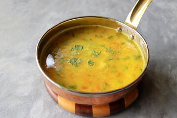 Healthy nutritious Indian comfort food Dal Chawal. Popular food yellow Dal Tadka or lentil curry. Protein rich superfood. copy space.