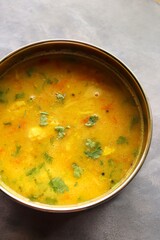 Healthy nutritious Indian comfort food Dal Chawal. Popular food yellow Dal Tadka or lentil curry. Protein rich superfood. copy space.