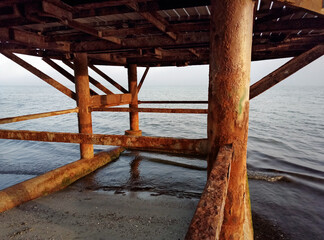 Rusty pillars of the old pier.
