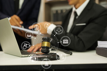 judge on wooden table And experienced lawyers meet with clients and give advice behind the scenes. legal services legal consulting concept