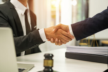 judge on wooden table And experienced lawyers meet with clients and give advice behind the scenes. legal services legal consulting concept