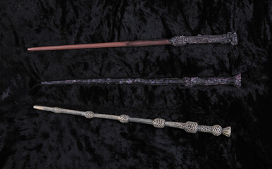 wooden magic wand on black velvet