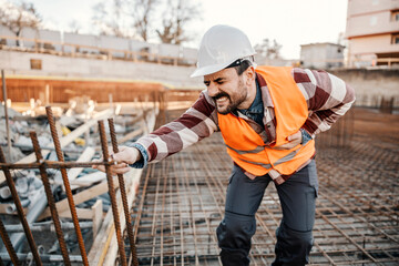 A site worker is having stomach ache and screaming in pain.