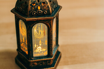 Arabic lantern with burning candle. close up.