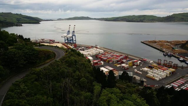 Colourful ocean containers are neatly stacked in the terminal at Port Chalmers in Dunedin, New Zealand.