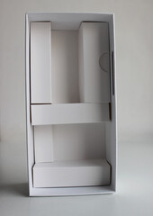 White Cardboard Container With Partitions, Reminiscent Of A Wardrobe Mockup