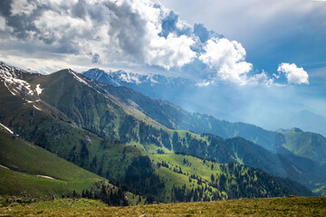 Amazing view landscape of summer in Almaty cloudy mountains in the Ile Alatau National Park.