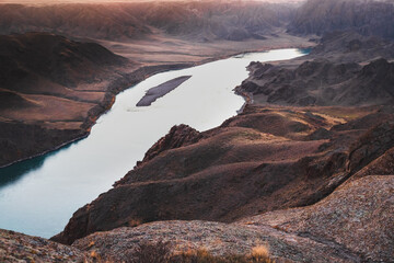 Ili river view in sunset light on steppe valley, Almaty region, Central Asian nature landscape.