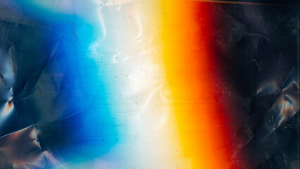 Distressed overlay. Dust scratches texture. Creased old film noise. Orange blue white rainbow color...