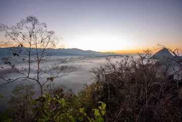 View of flowing fog  on mountain tropical rainforest in the morning
