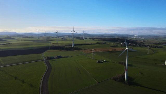 Generating Clean Energy in Sauerland: A Field of Wind Turbines Providing Sustainable Power on a Sunny Day in Brilon