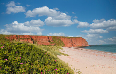 Red cliffs and rock formation on the north beach of the island of Heligoland. Heligoland is a nature reserve, is located in the middle of the North Sea and belongs to Germany.
