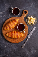 French croissant. Freshly baked croissants with butter coffee