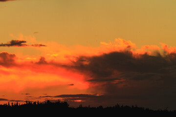 Sunset or dawn colorful sky with clouds. Wallpaper of an evening or morning sky