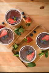 Delicious pastries in a craft glass with berries