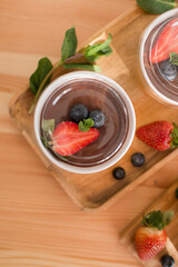 Delicious pastries in a craft glass with berries