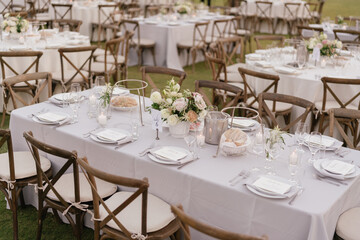 Fototapeta na wymiar outdoor event, white chairs and tables placed outside