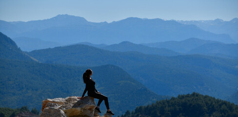 Young Woman Practicing Yoga in Amazing Landscape