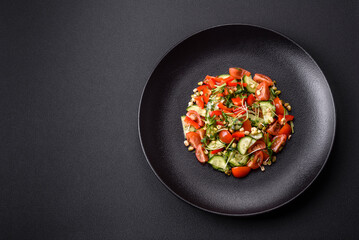 Delicious juicy fresh salad of tomatoes, peppers, cucumber, microgreens and sprouted mung bean