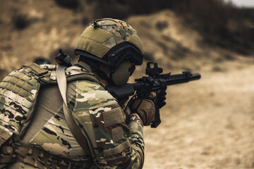 Fototapeta premium Sniper with rifle on a position
