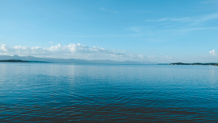 Full frame shot of lake, clouds and blue sky, backgrounds