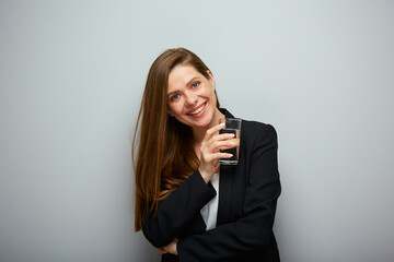 Woman in black jacket holding water glass. isolated female portrait with black suit.