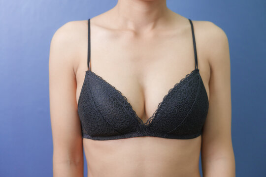 Cropped image of pretty young asian woman with black color bra, chest breast cancer early diagnostic therapy treatment