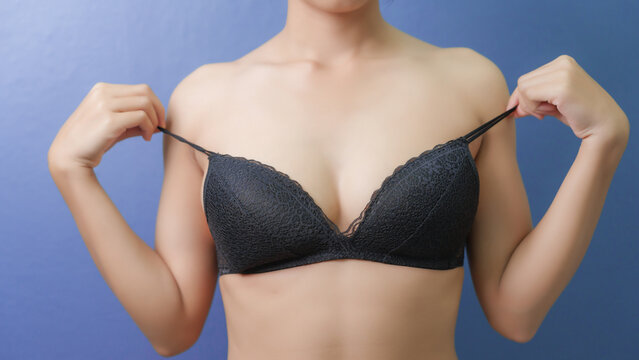 Cropped image of pretty young asian woman with black color bra, chest breast cancer early diagnostic therapy treatment