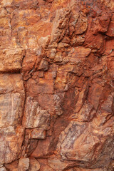 Abstract rock stone background with wall of red mountain texture
