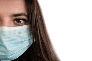Girl with medical respiratory mask against the virus. Surgical protective mask. Prevention of the spread of coronavirus , Covid-19, Omicron, useful for background,papers