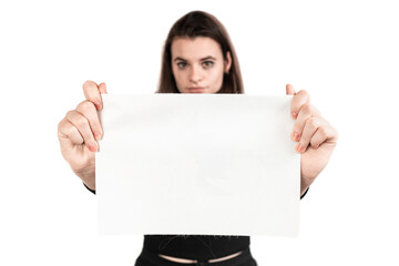 Fototapeta premium Beautiful brown-haired girl holds a white board in her hand, the girl is crying and sad, tears are running down her face, depression, violence, her okay not to be okey, useful for background
