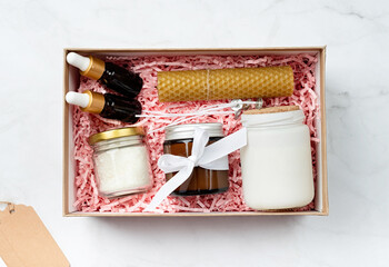 Gift box with candle making tools, candle, soy wax, wicks and aroma oil bottles