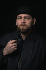 stylish man in retro outfit suit hat smoking wooden pipe sherlock holmes look cosplay england gentleman fashionable confident gangster Guy Ritchie Charlie Hunnam style