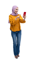 Asian Muslim woman in a headscarf using a mobile phone