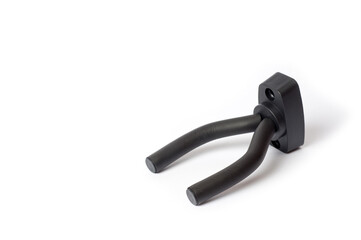 Wall mount for an acoustic or electric guitar, shot against a white background.