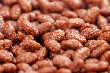 Chocolate cereal puffed rice flakes. Crispy popped choco breakfast