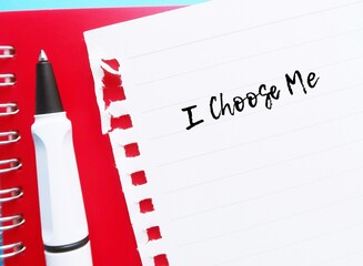 Pen on paper with handwritten text I CHOOSE ME, concept of self love affirmation, learn to love and have healthy relationship with oneself