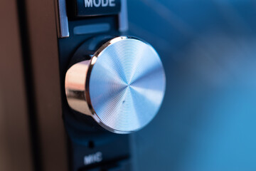 Closeup of volume controller on music system