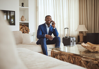 Happy businessman in hotel, on smartphone call and business communication for work in Atlanta. Young black entrepreneur, listening to audio on cellphone and sitting on luxury sofa in living room - obrazy, fototapety, plakaty