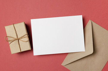 Blank Invntation or greeting card mockup with envelope and gift box