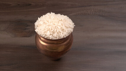 Uncooked dry rice in wooden bowl, Healthy food. Copy space.