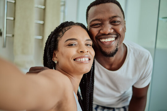 Selfie, smile and portrait of an African couple with love, home memory and happy in marriage. Smile, happiness and black man and woman with a content photo together in the living room with peace