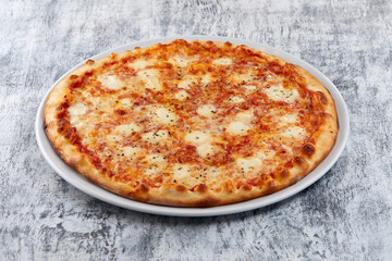 fresh pizza on the white plate