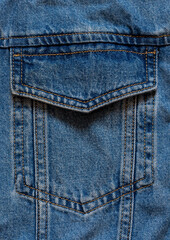 Blue denim fabric pocket macro texture. Close up